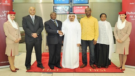 (L-r): Hafeez Azeem, Emirates regional manager commercial operations, Northern and Western Africa, Mike G. Omotosho, Nigeria’s Consul General in the UAE with Adil Al Ghaith, Emirates vice president commercial operations, Northern and Western Africa, at Dubai International Airport, with members of Emirates’ cabin crew for the start of the new daily Dubai-Abuja service.